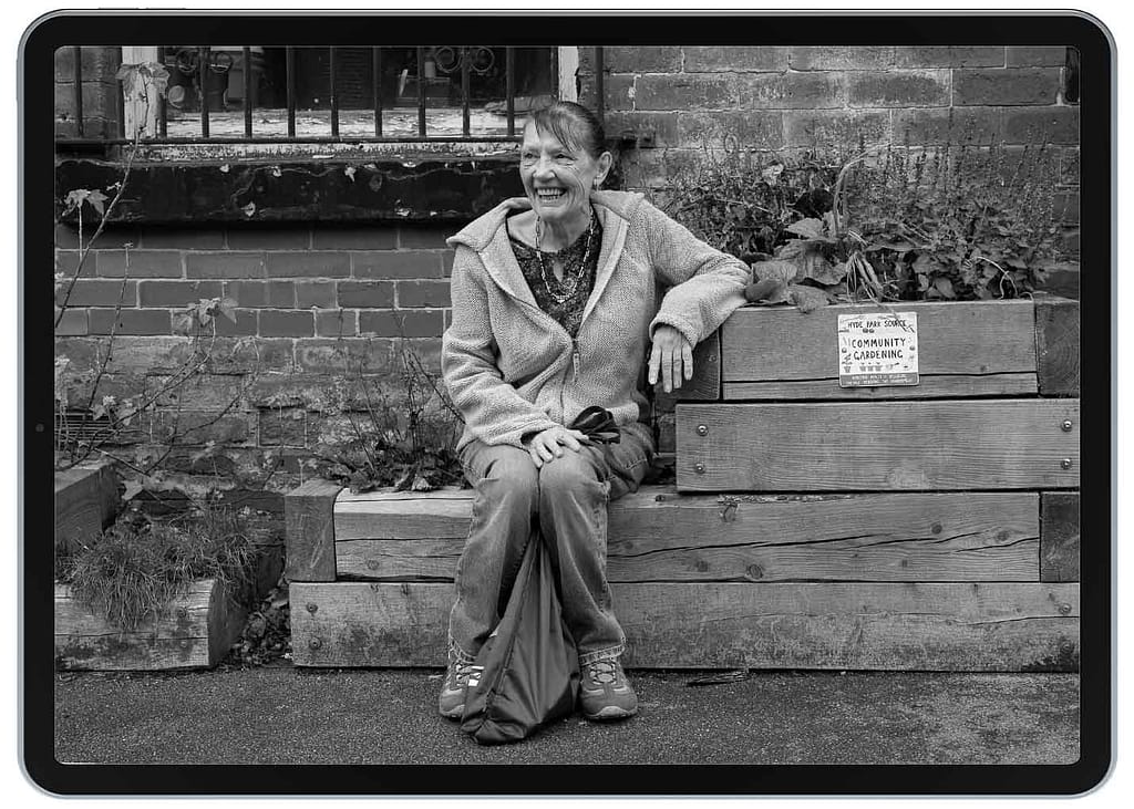 woman sat on wooden planter