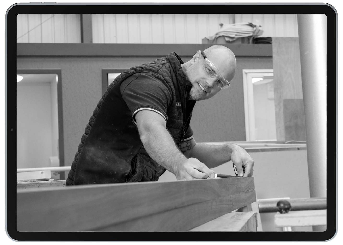 ipad-manufacturing manufacturing worker measuring wood