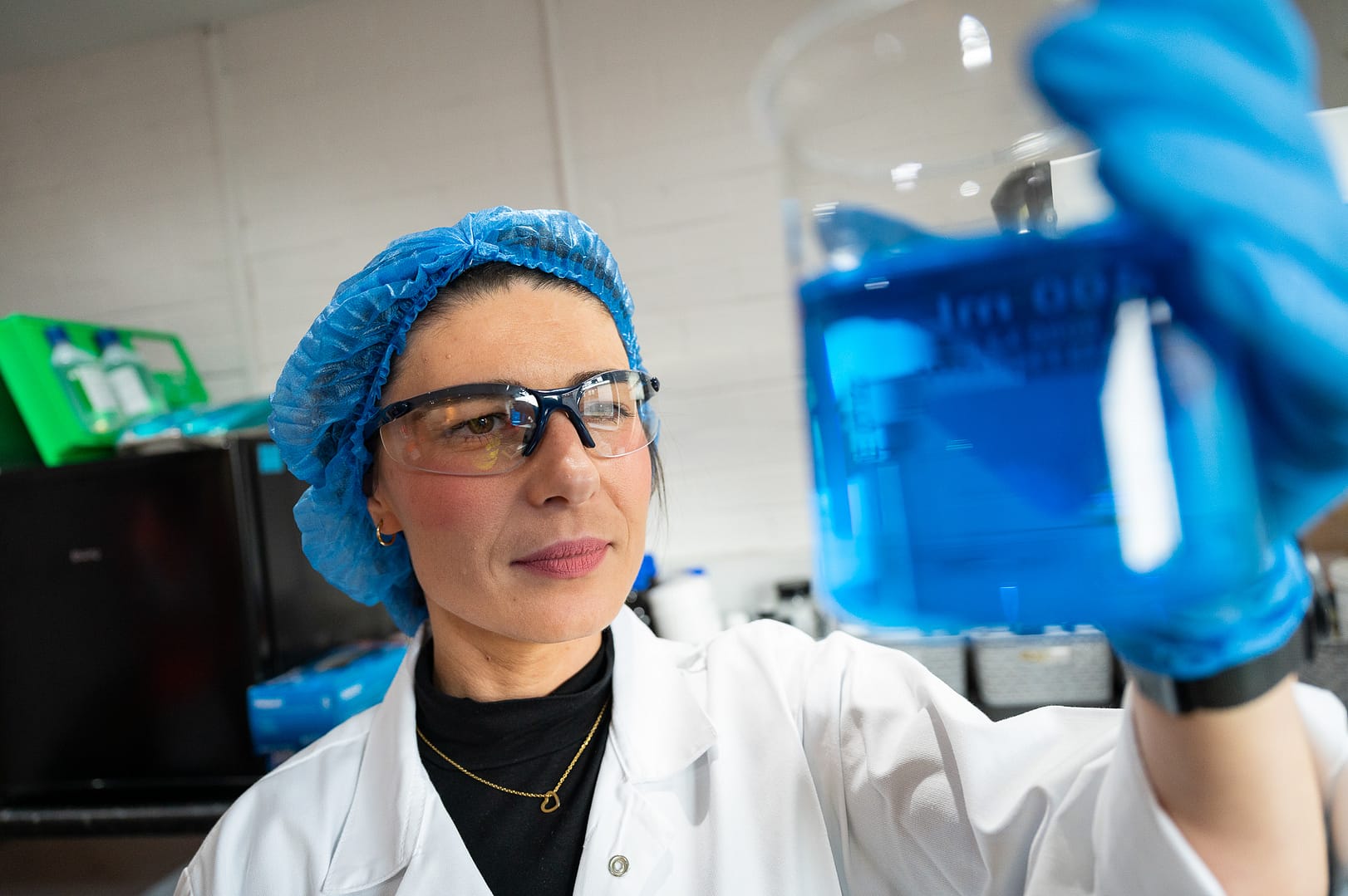 Marketing photography at BlueSky in Grimsby scientist observes chemicals in a beaker