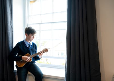 student at window